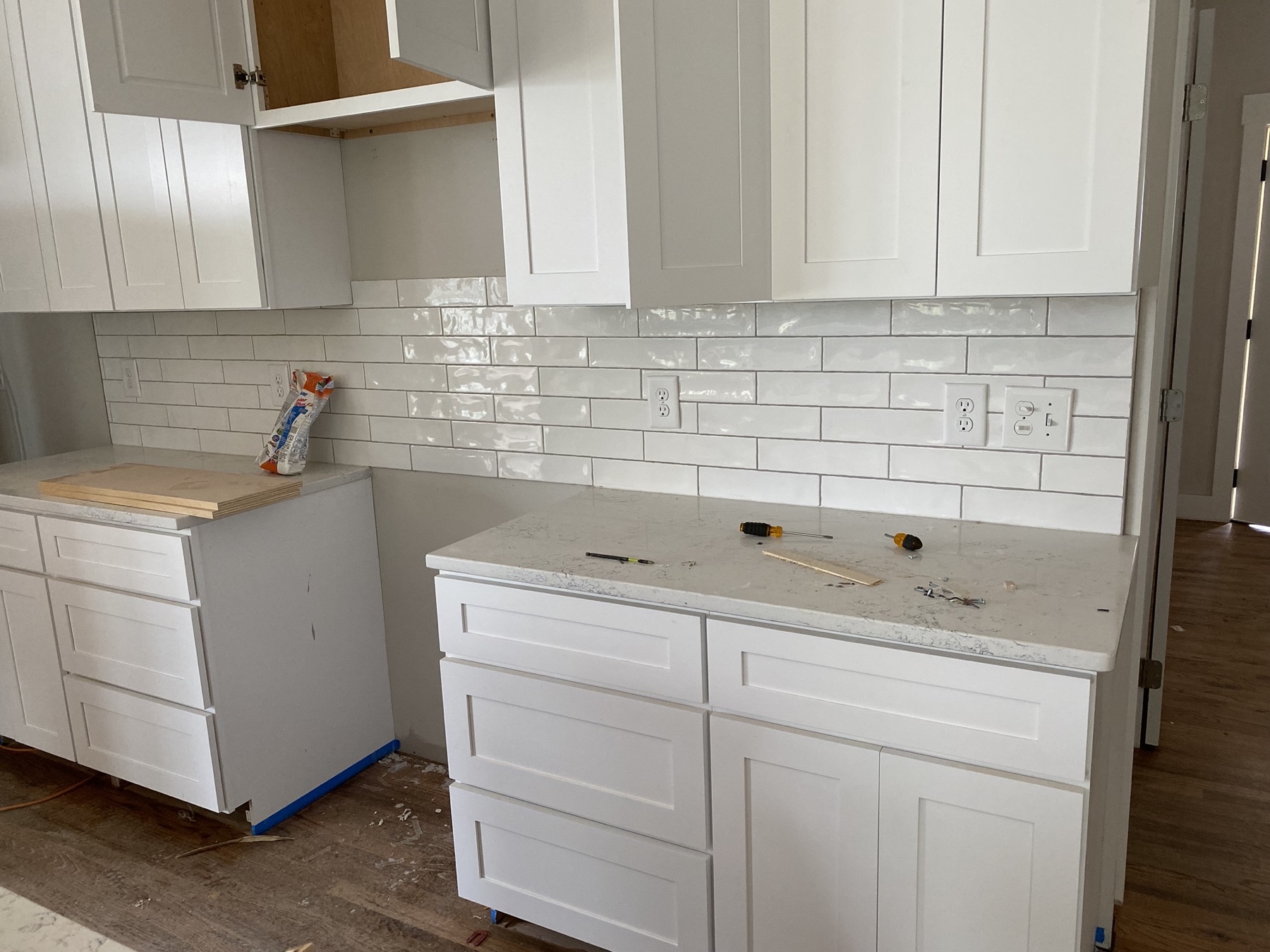 Tile backsplash install on a Renvo job site